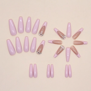 Long coffin press-on nails in pale pink with French gradient and glitter diamond accents