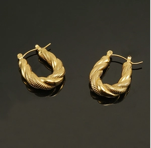 Close-up of 18K gold-plated stainless steel U-shaped hoop earrings with twisted rope texture