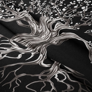 Detail shot of the life tree tapestry showing black and white fabric texture and soft folds
