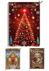Detailed view of three vertical Christmas garden flags with gingerbread house and gnome prints