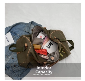 Detail view of large capacity travel bag interior showing laptop and essentials