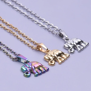 Rainbow, gold, and silver stainless steel elephant pendant necklaces on a purple background
