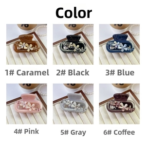 Detailed grid view of six floral hair claw clips decorated with small rhinestones in varied colors