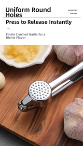 Macro shot of stainless steel garlic press holes on a wooden board with uniform circular hole