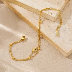 Double-layered evil eye gold-plated stainless steel bracelet with zircon stone accents