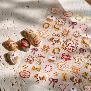 Macro detail of 3D dog nail art stickers with cute puppy, bone, and bow embossed patterns