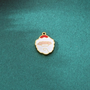 Detailed view of Santa Claus enamel pendant with golden trim for DIY jewelry making