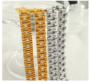 Detailed close-up of gold and silver watch-style bracelets with sparkling zircons