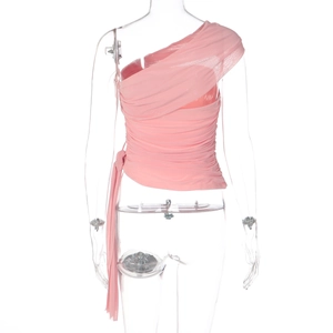 Detail of pink one-shoulder mesh top showing pleated texture and asymmetric draping style