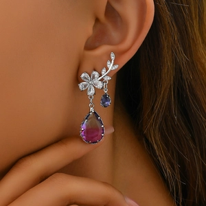Elegant floral drop earrings with purple crystal pendants and zircon leaves