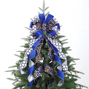 Navy and white patterned burlap Christmas tree topper bow with gold swirl ribbons