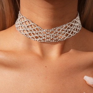 Close-up of sparkling wide silver rhinestone choker necklace on a female neck