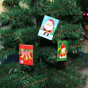 Christmas tree hanging ornaments set featuring Santa, snowman and bell on festive pine branches