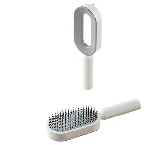 White minimalist air cushion hairbrush with gray massage bristles and hollow handle design