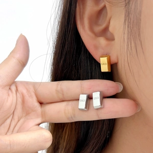 Titanium steel gold bar stud earrings featuring engraved GOLD text in gold and silver