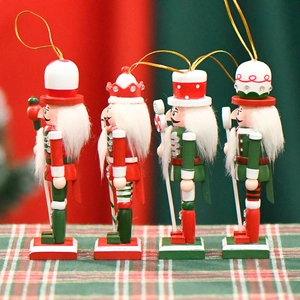 Set of four 13cm wooden Nutcracker soldier ornaments with festive red and green glitter finish