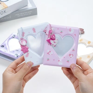 Mini 3-inch photo albums with heart cutouts in pink and white with cute rabbit patterns