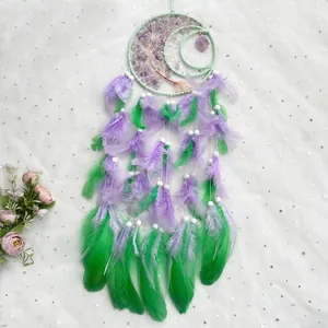 Moon-shaped dreamcatcher with tree of life crystal stones and colorful hanging feathers