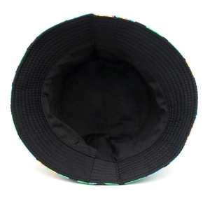 Detailed top view of reversible bucket hat showing black inner lining and patterned brim