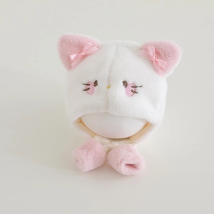 Detailed view of plush cat winter hat with soft faux fur and cute pink ribbon ears