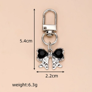 Detailed size and weight specs for the silver metal butterfly bow keychain with dimensions