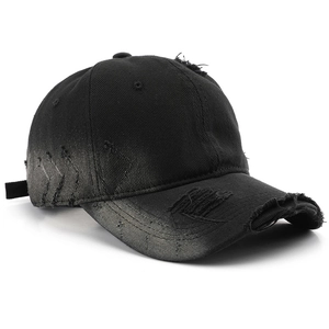 Distressed black vintage baseball cap with washed denim holes and adjustable strap