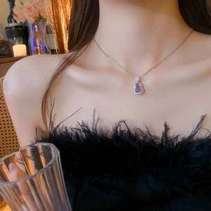 Elegant purple glass gourd pendant necklace with zircon inlay on a delicate silver chain
