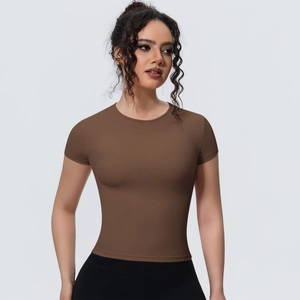 Detail of slim fit breathable yoga t-shirt in coffee brown showing fabric texture