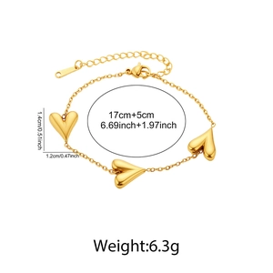 Detail view of heart charm bracelet showing 17cm plus 5cm length and 1.4cm pendant dimensions