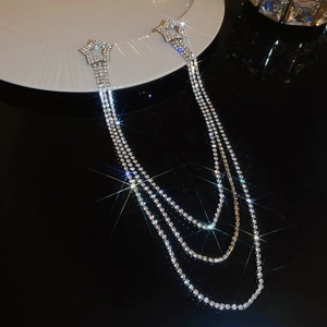 Detail of silver star tassels with sparkling rhinestones and elegant layered fringe chains