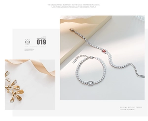 Detail view of silver tennis bracelets with red and white rectangular zircon stones