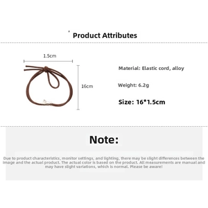 Detail view of cat and fish charms hair tie with measurements and weight specifications