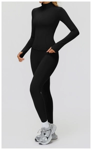Detail of black slim fit athletic jacket with thumbhole cuffs and zip-up stand collar