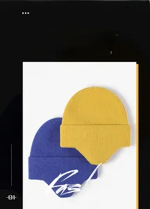 Detailed knit texture on winter earflap beanies in ginger and blue colors