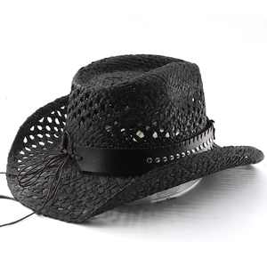 Close-up of black straw cowboy hat featuring silver studs and leather decorative band