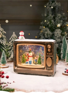 Macro detail of retro TV snow globe with snowman miniature and glowing glitter effects