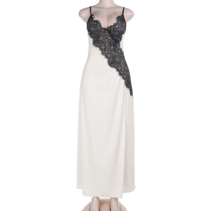 Close-up of deep V-neckline with black eyelash lace on cream satin maxi dress