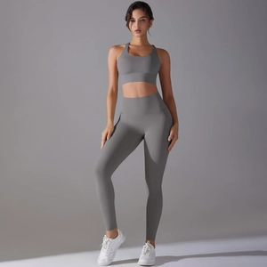 Close-up of seamless gray yoga set including racerback sports bra and high waisted leggings
