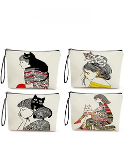 Detail view of four canvas makeup bags with artistic girl and cat illustrations