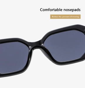 Detail view of comfortable integrated nosepads on these thick frame black sunglasses