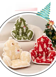 Detail of plush Christmas tree cushions with warm fleece texture and festive patterns