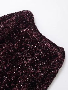 Close-up macro of wine red sequins fabric detail on elegant crew neck cocktail dress