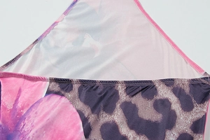 Detail of floral and leopard print stitching with pink overlock sewing on summer dress