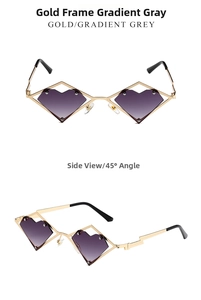 Detail of gold metal heart sunglasses with purple gradient lenses and lightning temple design
