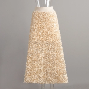 Detailed close-up of 3D rose textures and layered floral fabric on the A-line evening skirt