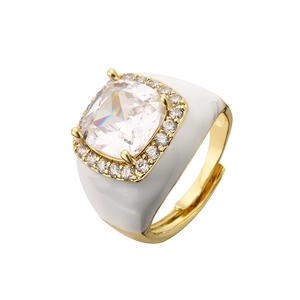 Detail of gold-plated brass ring with white enamel, cushion-cut zircon and adjustable band