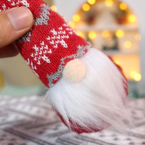 Detail of Christmas knitted gnome ornament with soft faux fur beard and texture