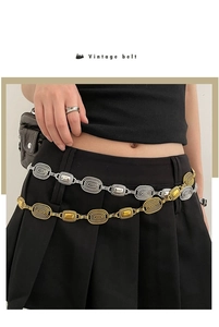 Detail showing vintage silver and gold waist chains with oval and rectangular textured links
