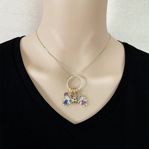 Custom gold family necklace with boy, soccer ball, and girl charms set in sparkling zircons