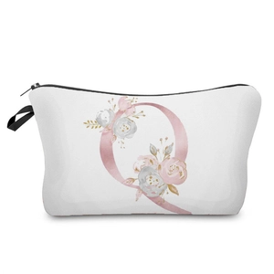 Detailed view of white floral pink letter Q printed cosmetic bag with black zipper closure